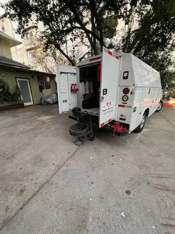 Magnet Plumbing service vehicle on-site for Grease Trap Cleaning in Alessandro Heights